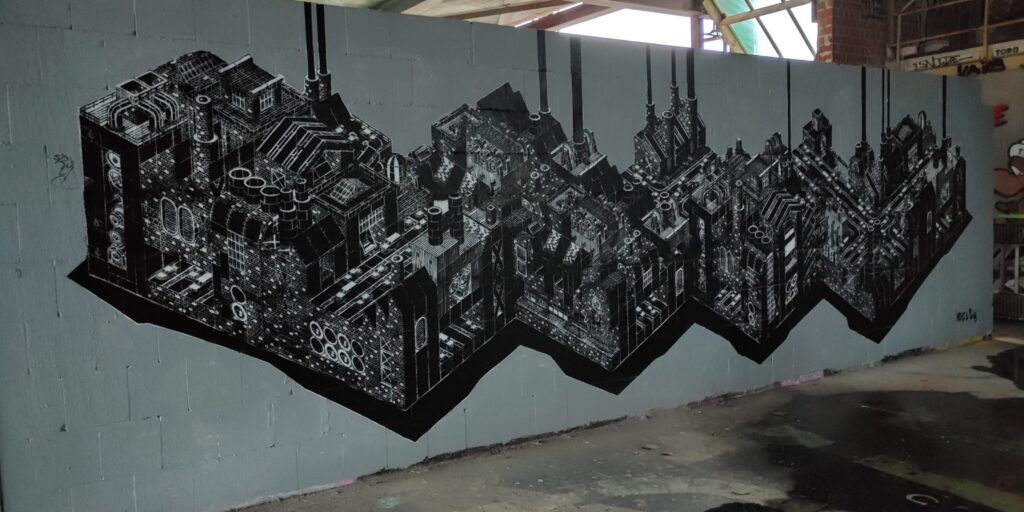 Graffiti mit grauen Fabriken